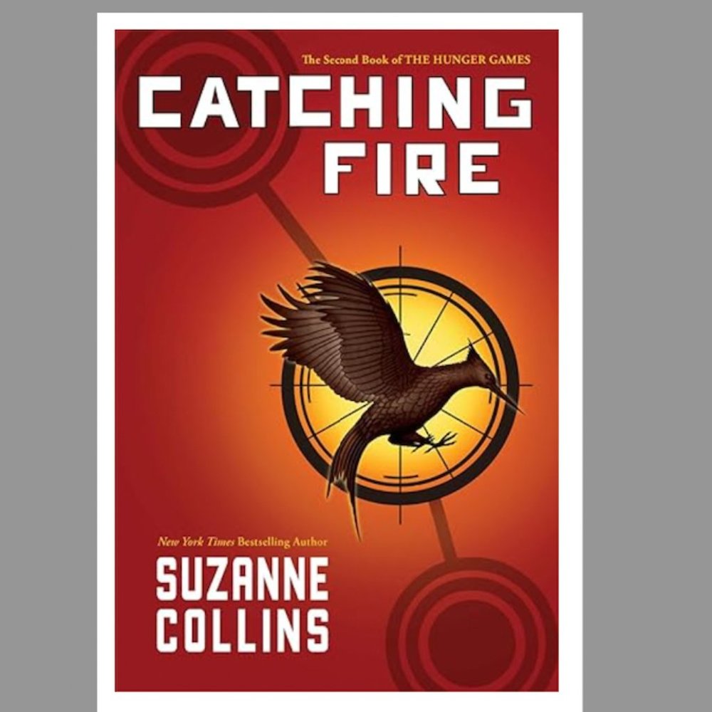 Catching Fire (The Hunger Games) Hardcover Book.